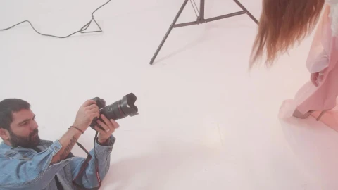 Stock Video Experienced Photographer During A Photo Shoot With A Model Live Wallpaper For PC - Free Live Wallpaper