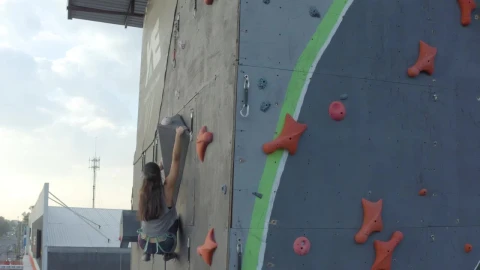 Stock Video Experienced Female Mountaineer Climbing On Top Of A Wall Live Wallpaper For PC - Free Live Wallpaper