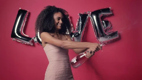 Stock Video Excited Woman With A Frothy Bottle Of Cider On Valentines Live Wallpaper For PC - Free Live Wallpaper