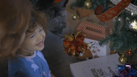 Stock Video Excited Girl Opening Gifts On Christmas Morning Live Wallpaper For PC - Free Live Wallpaper