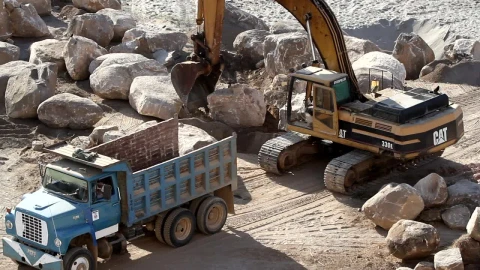 Stock Video Excavation Crane Lifts A Rock Into A Truck Live Wallpaper For PC - Free Live Wallpaper