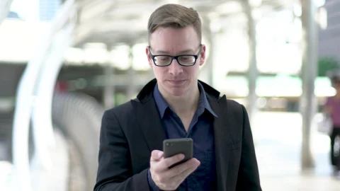 Stock Video Entrepreneur Young Man Wearing Glasses On A Call Live Wallpaper For PC - Free Live Wallpaper
