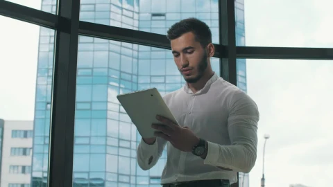Stock Video Entrepreneur Working On A Tablet In His Office Live Wallpaper For PC - Free Live Wallpaper