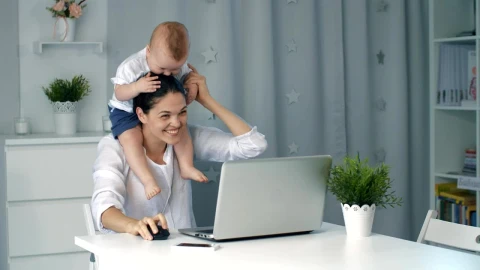 Stock Video Enterprising Mom Plays With Her Baby While Working Live Wallpaper For PC - Free Live Wallpaper