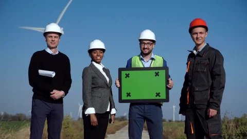 Stock Video Engineers On A Wind Farm Holding A Green Screen Live Wallpaper For PC - Free Live Wallpaper