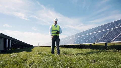 Stock Video Engineer Walking Through A Field With Solar Panels Live Wallpaper For PC - Free Live Wallpaper
