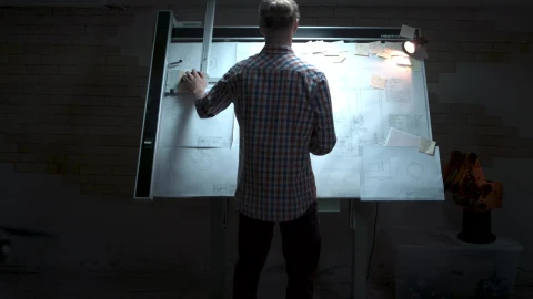 Stock Video Engineer Looking Over Plans On A Board Live Wallpaper For PC - Free Live Wallpaper
