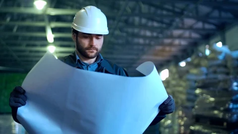 Stock Video Engineer Holding A Blueprint In A Warehouse Live Wallpaper For PC - Free Live Wallpaper