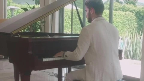 Stock Video Elegant Man Playing The Piano In A Lobby Live Wallpaper For PC - Free Live Wallpaper