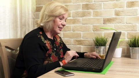Stock Video Elderly Woman Using A Laptop Live Wallpaper For PC - Free Live Wallpaper