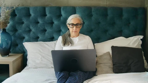 Stock Video Elderly Woman On Laptop In Blue Bedroom Live Wallpaper For PC - Free Live Wallpaper