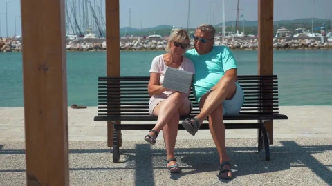 Stock Video Elderly Couple Using A Tablet By A Harbor Live Wallpaper For PC - Free Live Wallpaper
