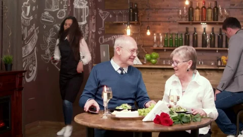 Stock Video Elderly Couple Pay For Dinner With Mobile Phone Live Wallpaper For PC - Free Live Wallpaper