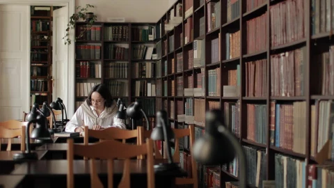 Stock Video Educated Woman Studies For Exam In University Library Live Wallpaper For PC - Free Live Wallpaper
