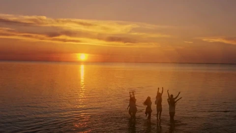 Stock Video Dreamy Sunset View Of People Jumping On Sea Surface Live Wallpaper For PC - Free Live Wallpaper
