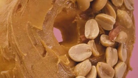 Stock Video Donut With Peanut Butter And Peanuts On A Pink Background Live Wallpaper For PC - Free Live Wallpaper