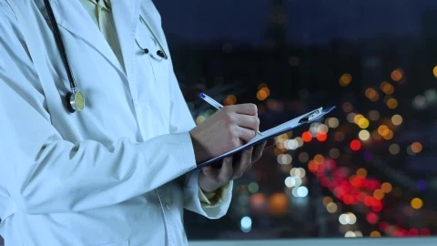 Stock Video Doctor Writing A Prescription With An Unfocused Street Background Live Wallpaper For PC - Free Live Wallpaper