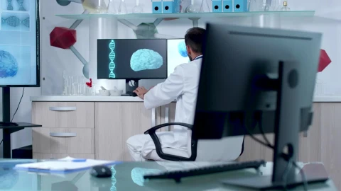 Stock Video Doctor Working On Dna And Brain Models In Lab Live Wallpaper For PC - Free Live Wallpaper