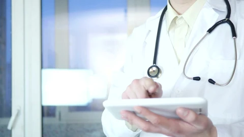 Stock Video Doctor Working On A Tablet Device Live Wallpaper For PC - Free Live Wallpaper