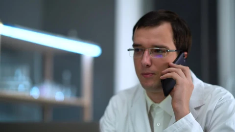 Stock Video Doctor With Glasses Talking On The Phone Live Wallpaper For PC - Free Live Wallpaper
