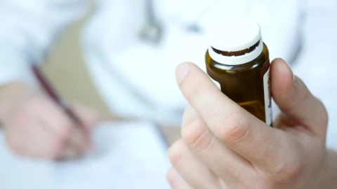 Stock Video Doctor With A Bottle Of Pills On The Hand Live Wallpaper For PC - Free Live Wallpaper