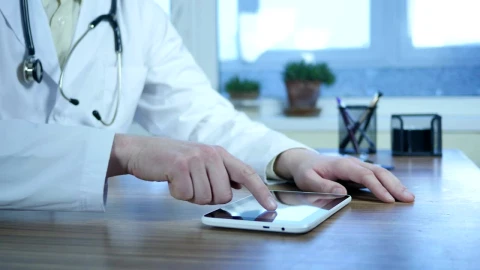 Stock Video Doctor Typing On A Tablet In The Office Live Wallpaper For PC - Free Live Wallpaper