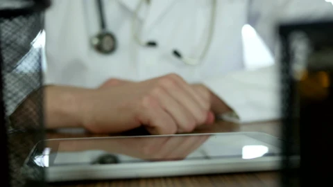 Stock Video Doctor Typing On A Tablet In The Desk Live Wallpaper For PC - Free Live Wallpaper