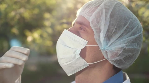 Stock Video Doctor Taking Off His Mask And Sighing Live Wallpaper For PC - Free Live Wallpaper