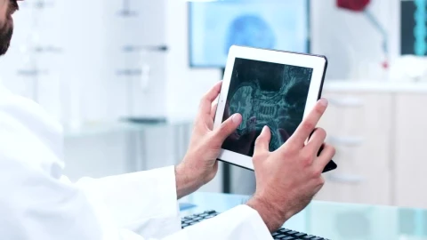 Stock Video Doctor Reviewing A Scan On Their Tablet Live Wallpaper For PC - Free Live Wallpaper