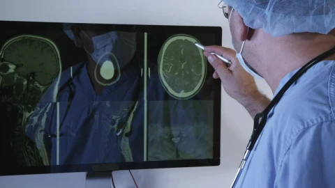 Stock Video Doctor Reviewing A Brain Scan Live Wallpaper For PC - Free Live Wallpaper