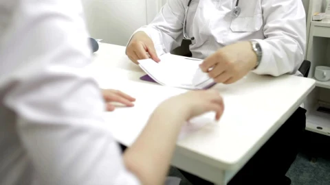 Stock Video Doctor Looking Over Patient Treatment Live Wallpaper For PC - Free Live Wallpaper