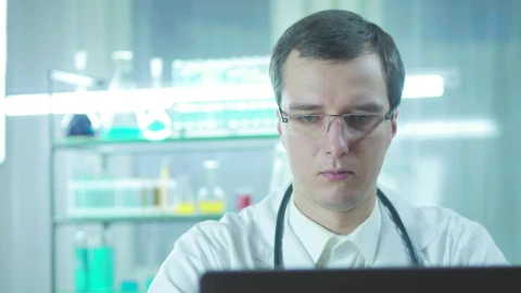 Stock Video Doctor In The Lab Looking At The Computer Screen Live Wallpaper For PC - Free Live Wallpaper