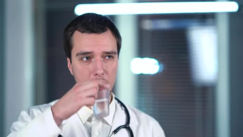 Stock Video Doctor Drinking Form A Plastic Cup Live Wallpaper For PC - Free Live Wallpaper