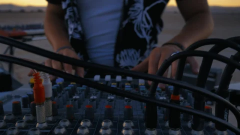 Stock Video Dj Using A Console Mixing In A Desert Live Wallpaper For PC - Free Live Wallpaper