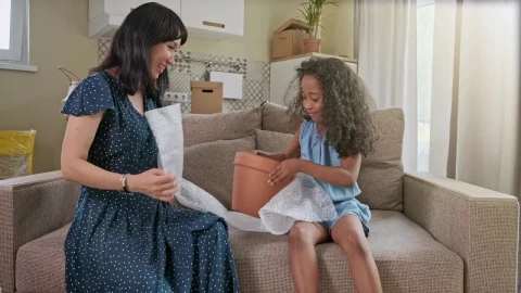 Stock Video Diverse Mom And Daughter Play On Sofa In New Home Live Wallpaper For PC - Free Live Wallpaper