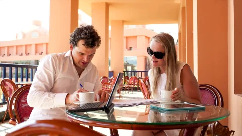 Stock Video Discussing Business Plans Over Coffee Live Wallpaper For PC - Free Live Wallpaper