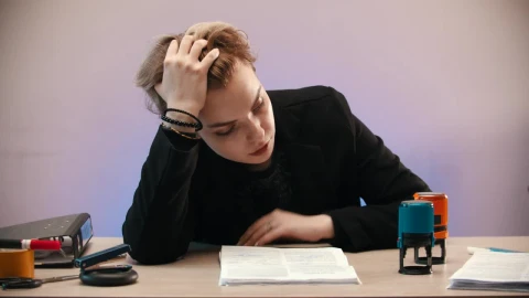 Stock Video Discouraged Woman Sealing Sheets In Her Office Live Wallpaper For PC - Free Live Wallpaper