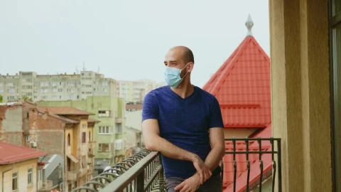 Stock Video Depressed Man Stands On Balcony In Face Mask Live Wallpaper For PC - Free Live Wallpaper