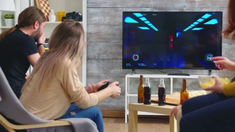 Stock Video Friends Enjoy Video Gaming On Sofa At Party Live Wallpaper For PC - Free Live Wallpaper