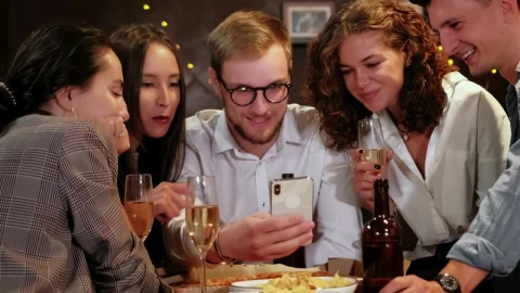 Stock Video Friends Celebrating A Special Date Look At A Cell Phone Live Wallpaper For PC - Free Live Wallpaper