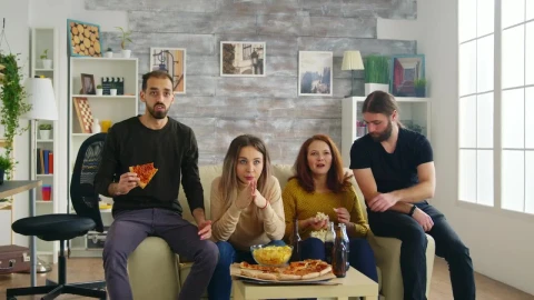 Stock Video Friends Celebrate Sports Victory On Sofa With Pizza Live Wallpaper For PC - Free Live Wallpaper