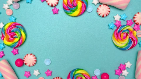 Stock Video Frame Of Candies Lollipops And Chocolates On A Blue Background Live Wallpaper For PC - Free Live Wallpaper