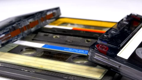 Stock Video Four Audio Cassettes Rotating On A White Surface Live Wallpaper For PC - Free Live Wallpaper