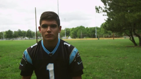 Stock Video Football Player Putting On A Helmet Live Wallpaper For PC - Free Live Wallpaper