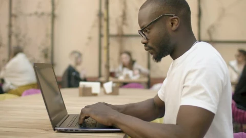 Stock Video Focused Man Types On Laptop In Outdoor Cafe Live Wallpaper For PC - Free Live Wallpaper