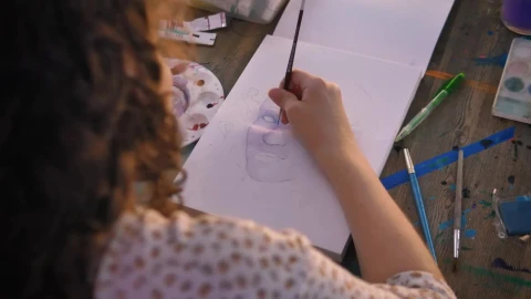 Stock Video Focus On The Hand Of An Artist Girl Painting With Live Wallpaper For PC - Free Live Wallpaper
