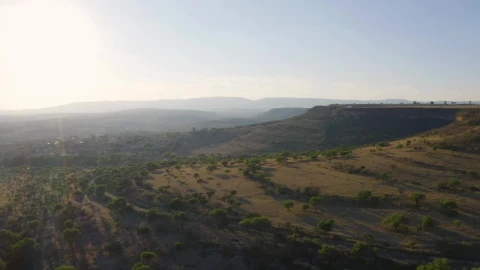 Stock Video Flying Over Mountain Ranges In The Warm Savanna Live Wallpaper For PC - Free Live Wallpaper