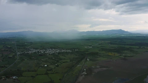 Stock Video Flying Over A Large Plain With A Town Plots And Live Wallpaper For PC - Free Live Wallpaper