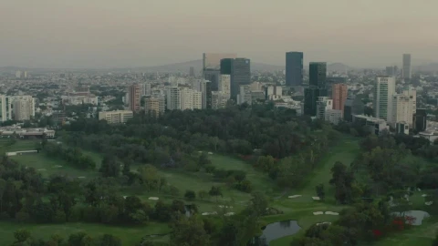 Stock Video Flying Over A Large Park Surrounded By A Metropolis Live Wallpaper For PC - Free Live Wallpaper