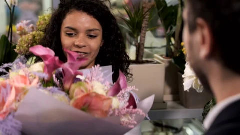 Stock Video Florist Handing A Bundle Of Flowers To A Customer Live Wallpaper For PC - Free Live Wallpaper